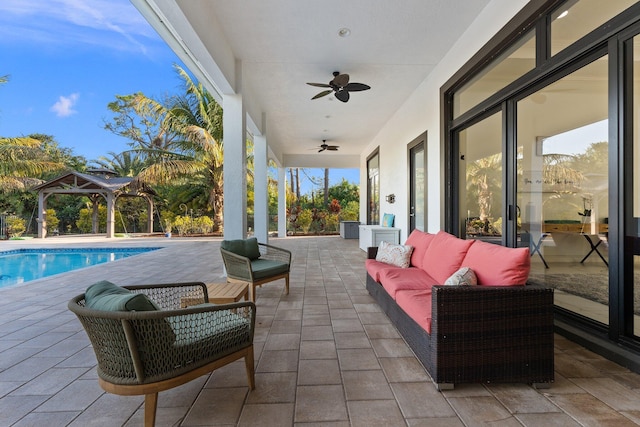 view of patio featuring a gazebo, outdoor lounge area, and ceiling fan