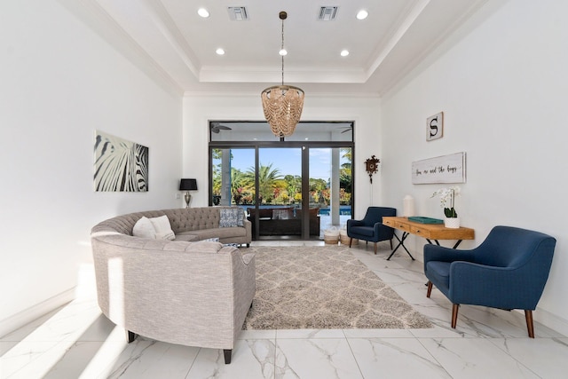 living room with french doors, ornamental molding, a high ceiling, and a tray ceiling