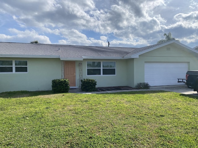 single story home with a front lawn and a garage