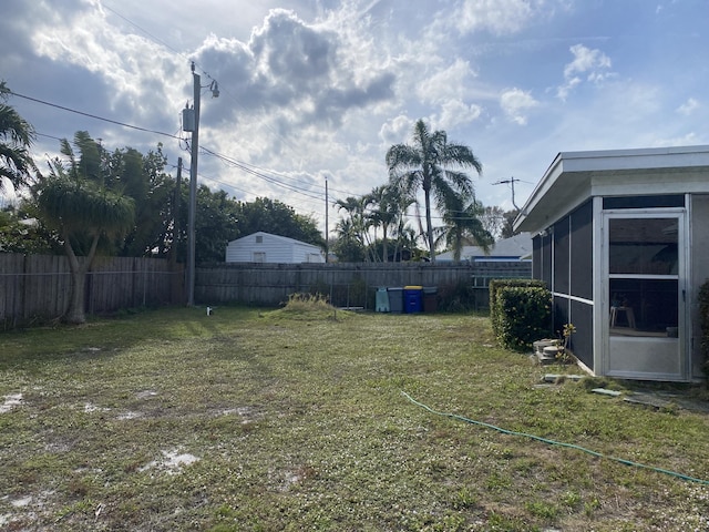 view of yard with a sunroom