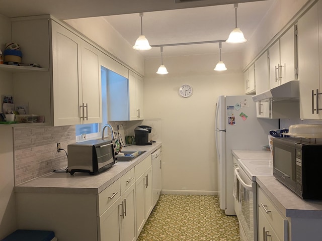 kitchen with hanging light fixtures, white cabinets, white appliances, and track lighting