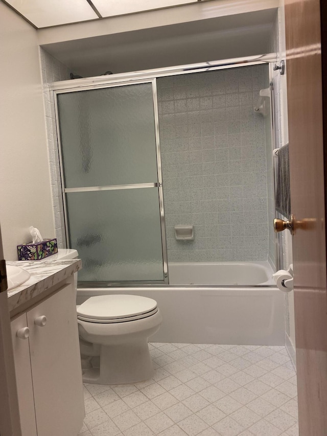 full bathroom with toilet, enclosed tub / shower combo, and vanity