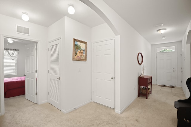 hallway with light carpet