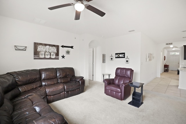 living room featuring light carpet and ceiling fan