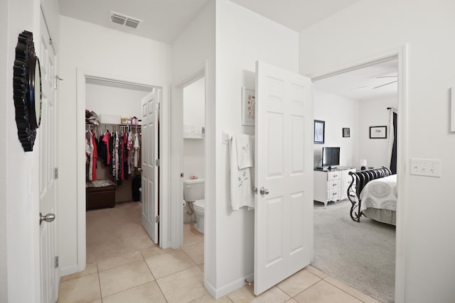 bathroom with tile patterned floors and toilet