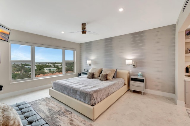 carpeted bedroom with heating unit and ceiling fan