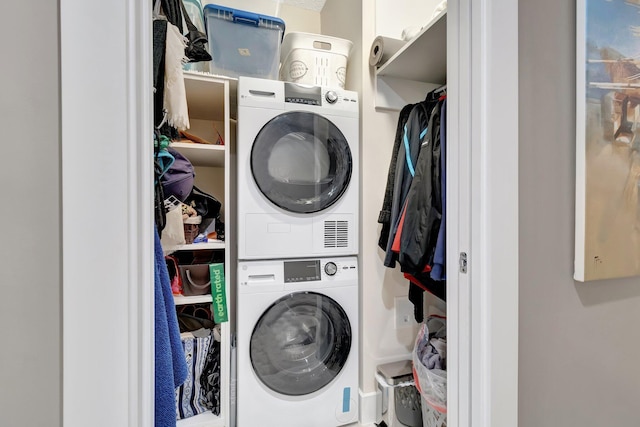 washroom with stacked washer / drying machine