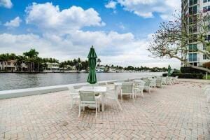 view of patio with a water view