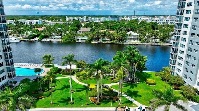 birds eye view of property with a water view