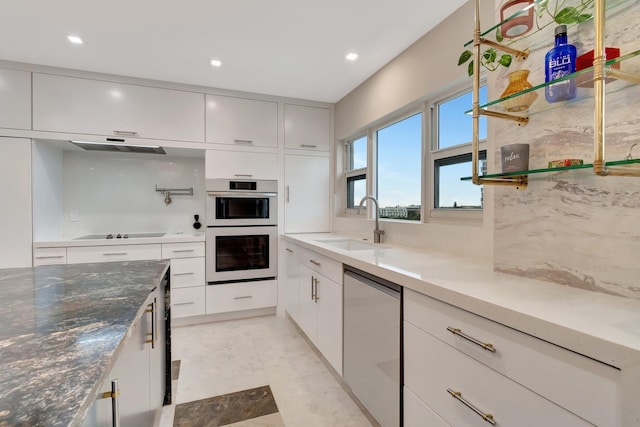 kitchen with dishwashing machine, white cabinets, sink, white double oven, and black electric cooktop