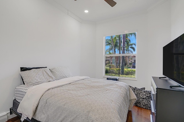 bedroom with dark wood-style flooring, ornamental molding, ceiling fan, and recessed lighting