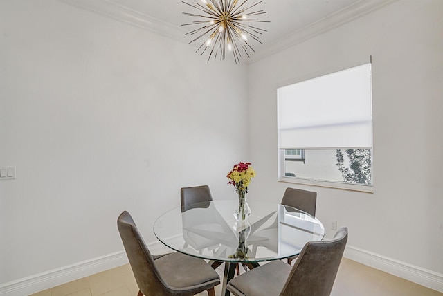 dining area with ornamental molding, baseboards, and a chandelier