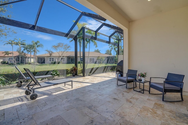 view of patio with a residential view and a lanai