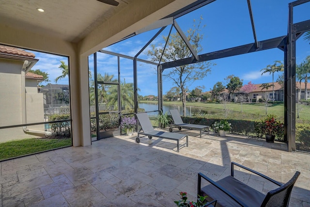 unfurnished sunroom with a water view