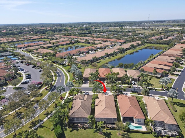 bird's eye view featuring a residential view and a water view