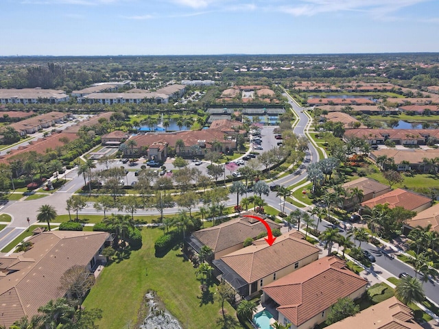 bird's eye view with a residential view and a water view