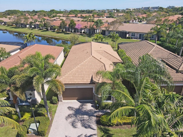 bird's eye view with a residential view and a water view