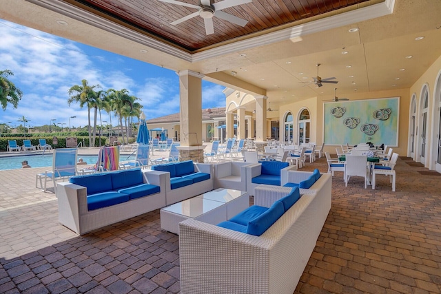 view of patio / terrace featuring ceiling fan, an outdoor hangout area, a community pool, and outdoor dining space