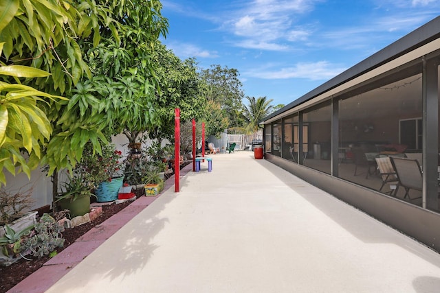 view of patio / terrace with a sunroom