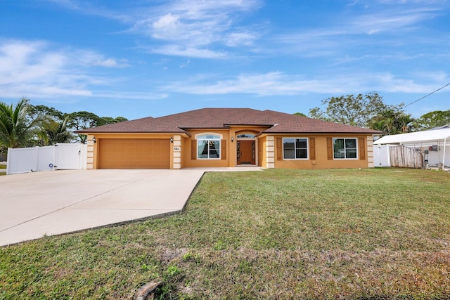 ranch-style home with a garage and a front lawn