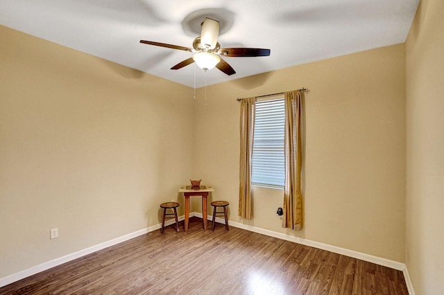 unfurnished room with ceiling fan and wood-type flooring