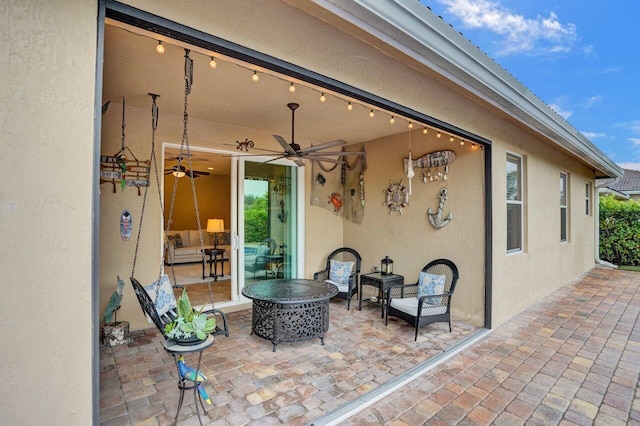 view of patio / terrace featuring ceiling fan