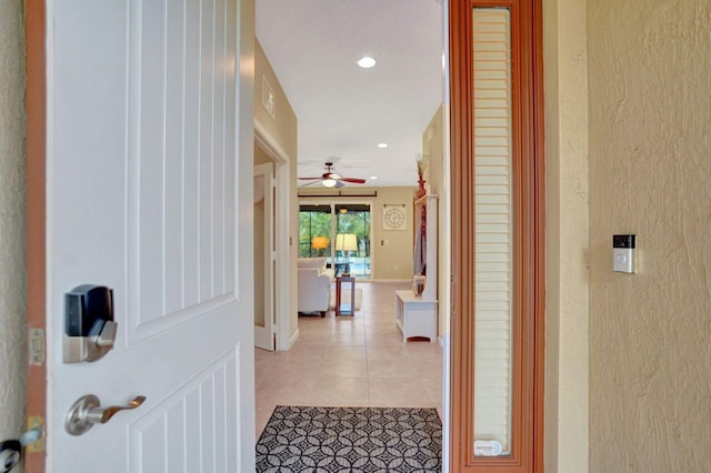 corridor featuring light tile patterned floors