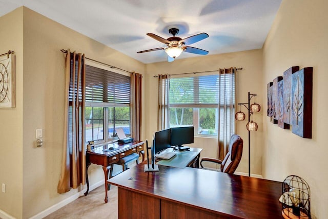 tiled office space featuring ceiling fan