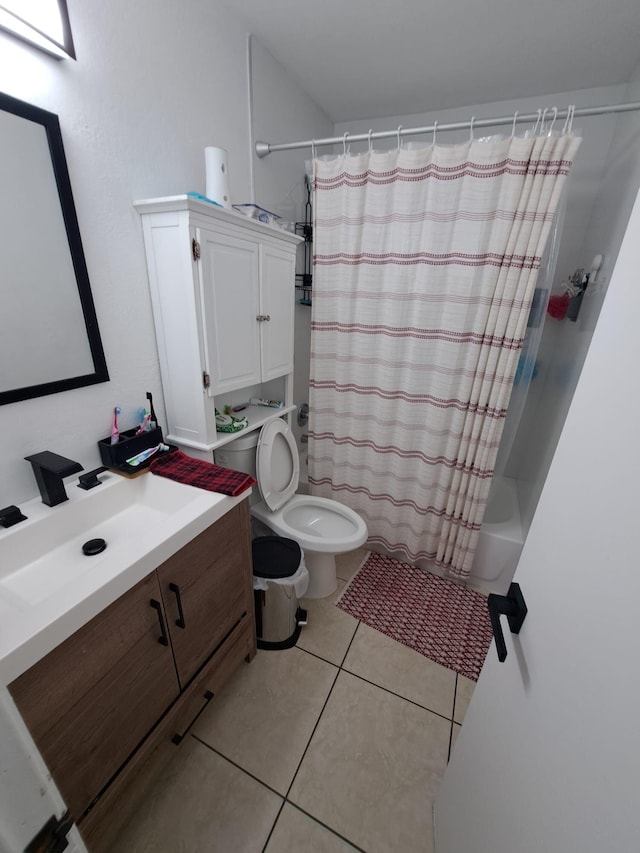 full bathroom with toilet, shower / tub combo, tile patterned floors, and vanity