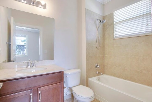 full bathroom featuring toilet, vanity, and tiled shower / bath