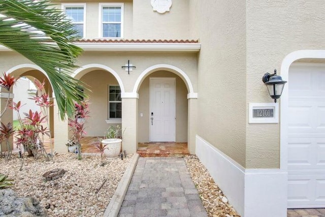 doorway to property featuring a garage