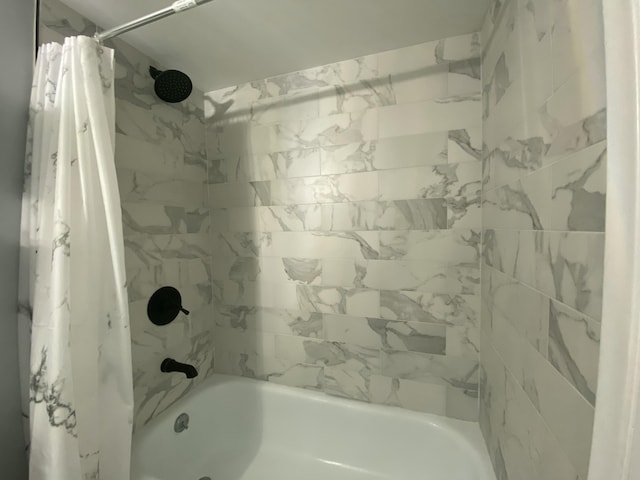 bathroom with shower / tub combo