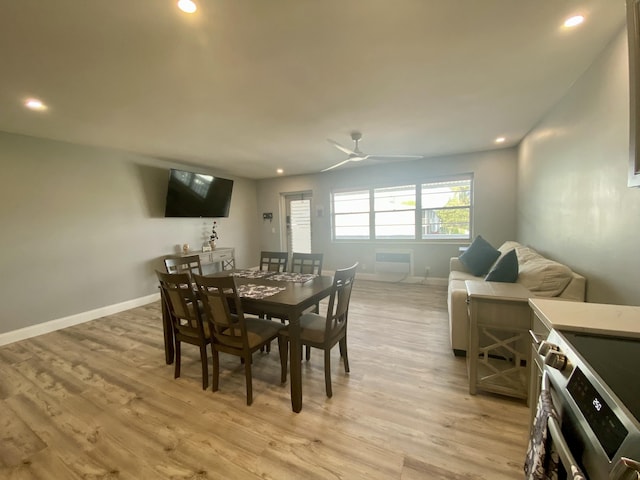 dining area featuring ceiling fan and light hardwood / wood-style flooring