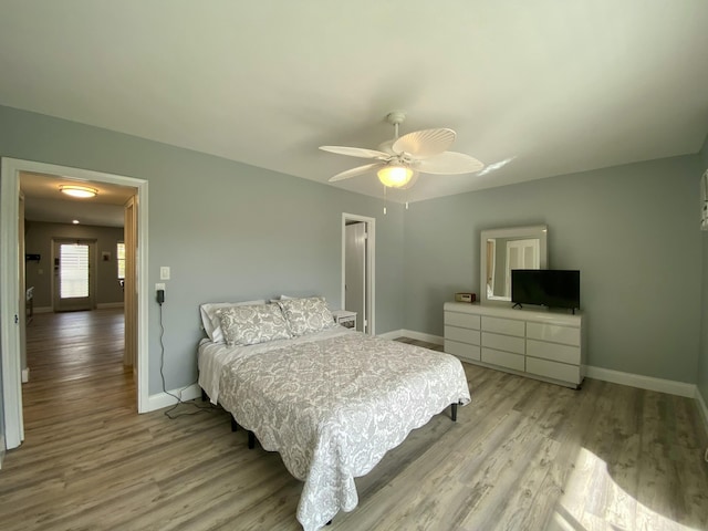 bedroom featuring ceiling fan and light hardwood / wood-style flooring