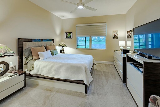 bedroom featuring ceiling fan and light colored carpet