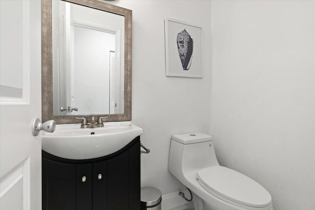 bathroom with toilet and vanity