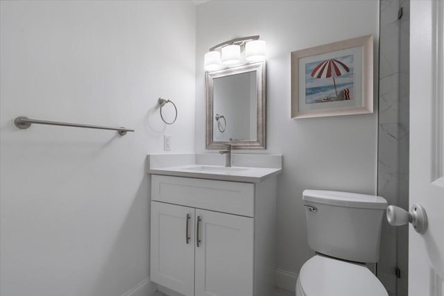 bathroom with toilet and vanity