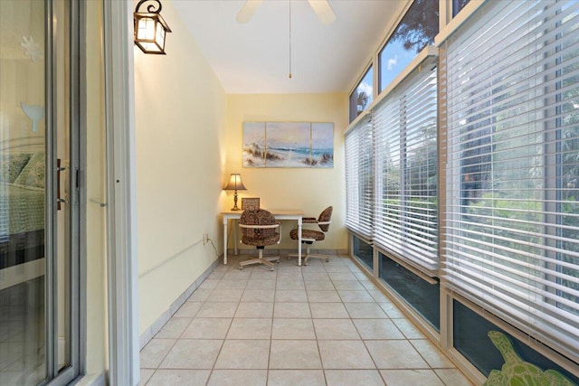 sunroom / solarium featuring ceiling fan