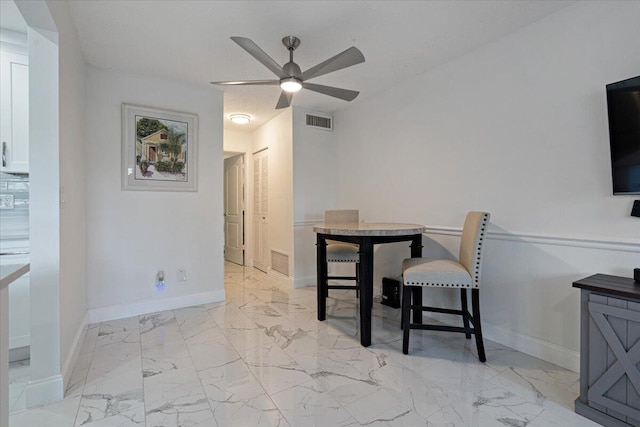 dining room featuring ceiling fan