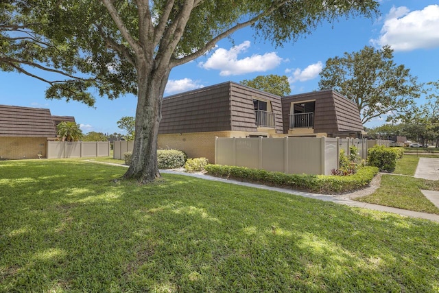 view of home's exterior with a yard