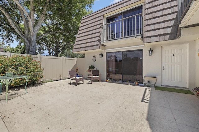 view of patio / terrace with a balcony