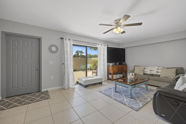 tiled living room featuring ceiling fan