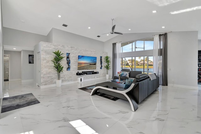 living room featuring ceiling fan and high vaulted ceiling