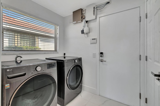 laundry area featuring washing machine and dryer