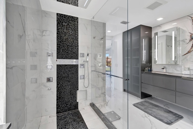 bathroom featuring vanity, tile walls, and tiled shower