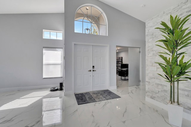 entryway with high vaulted ceiling