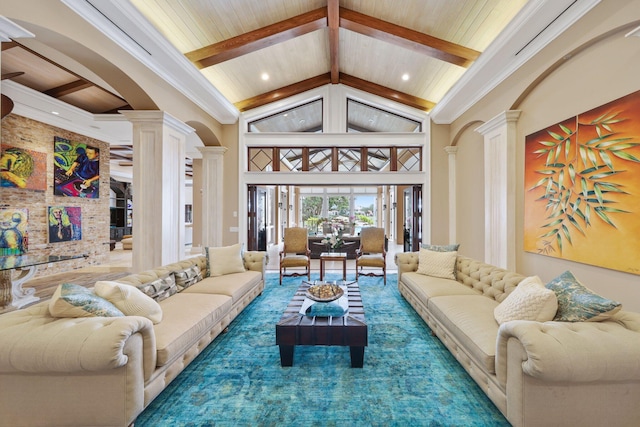 living room with crown molding, beam ceiling, high vaulted ceiling, and ornate columns