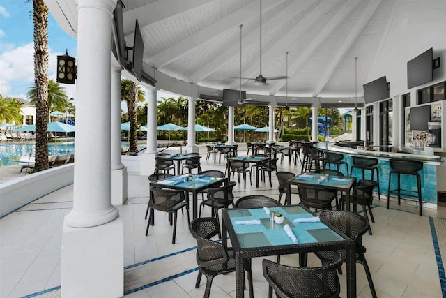 view of patio / terrace with a gazebo, ceiling fan, and exterior bar