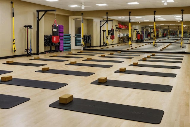 exercise room with hardwood / wood-style flooring