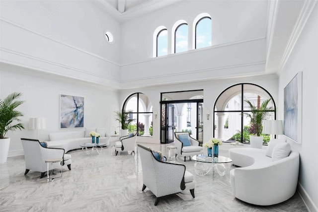 living room with a towering ceiling and a healthy amount of sunlight